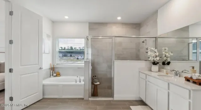 a bathroom with a sink vanity and mirror