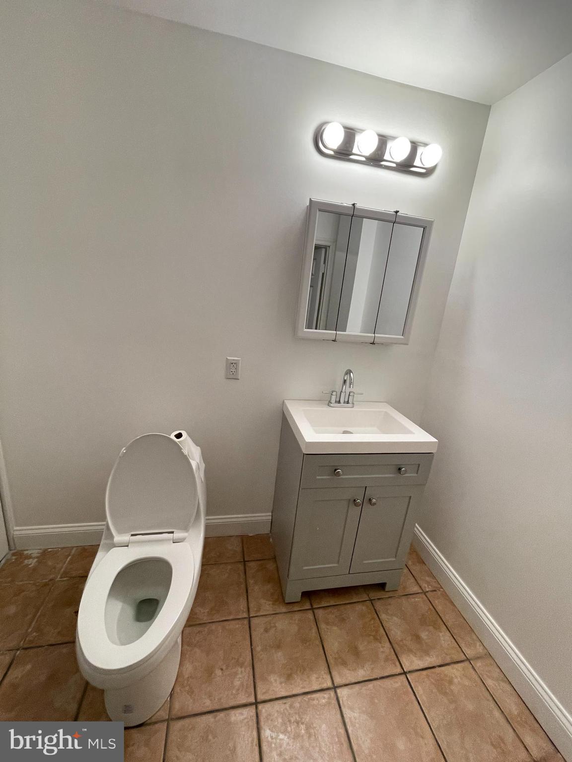 1020 Hamilton Street, Unit 4 Philadelphia, PA 19123 - Photo 13 of 19 a bathroom with a sink toilet and a mirror