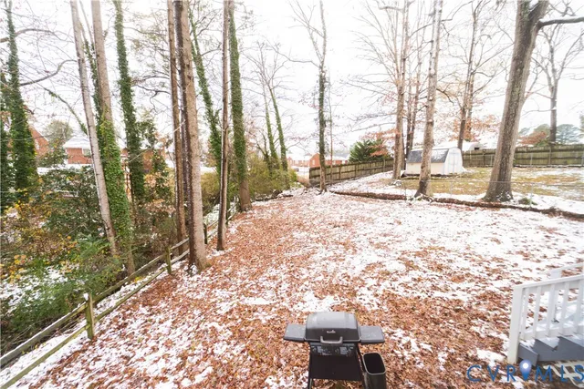 a view of a backyard of the house