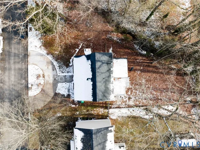 a view of a house with large trees