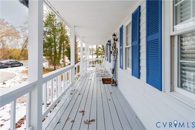 a view of a balcony with wooden floor