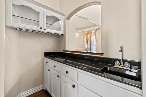a close view of a sink and a mirror in a room