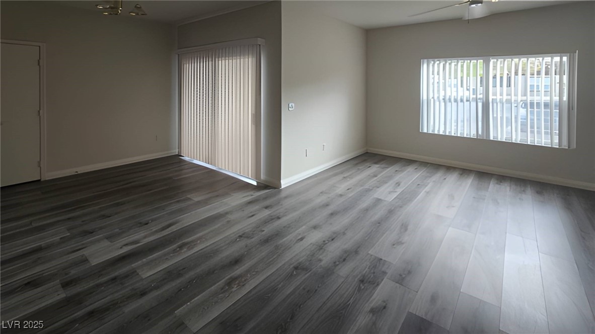 6650 West Warm Springs Road, Unit 1064 Las Vegas, NV 89118 - Photo 3 of 10 Spare room featuring wood finished floors and ceiling fan