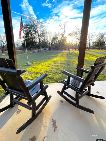 a view of a swimming pool with a lounge chair