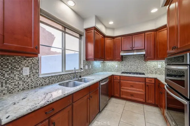 a view of a storage and utility room with washer and dryer