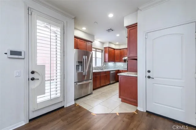a bathroom with a sink vanity and a toilet