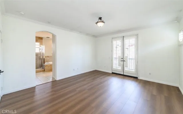 a front view of a house with plants