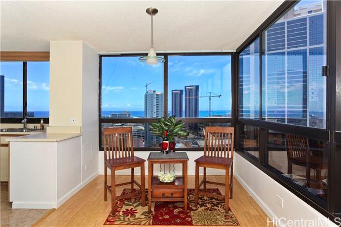 876 Curtis Street, Unit 2306 Honolulu, HI 96813 - Photo 1 of 1 a view of a dining room with furniture window and wooden floor