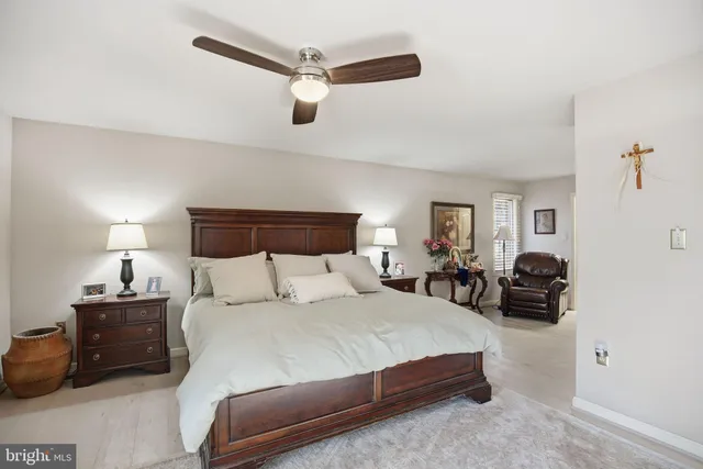 a bathroom with a double vanity sink mirror and toilet