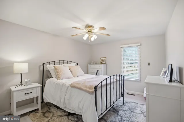 a bathroom with a sink vanity granite and toilet