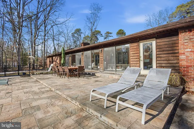 a view of a swimming pool with a patio