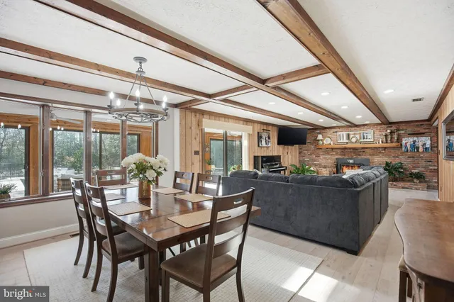 a large kitchen with cabinets a sink and stainless steel appliances