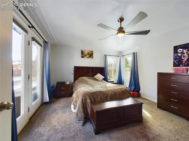 a spacious bedroom with a bed dresser and a window