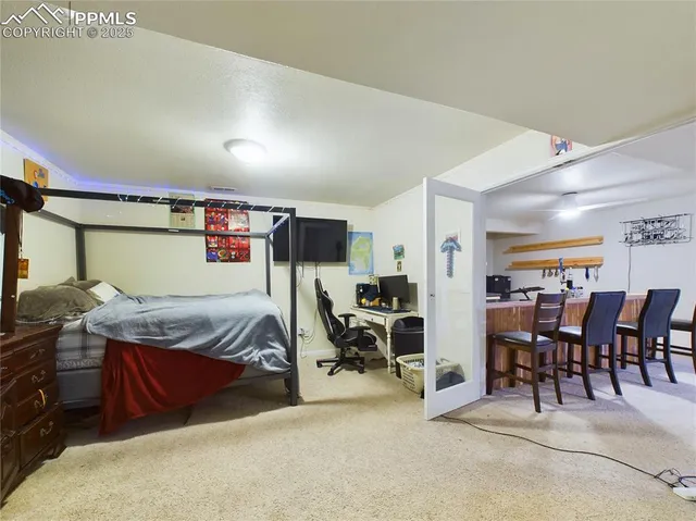a bedroom with furniture and window