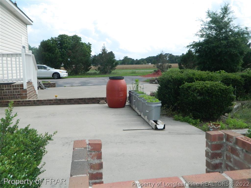 50 Cutoff Road Dunn, NC 28334 - Photo 30 of 33 a view of a terrace with yard and outdoor seating