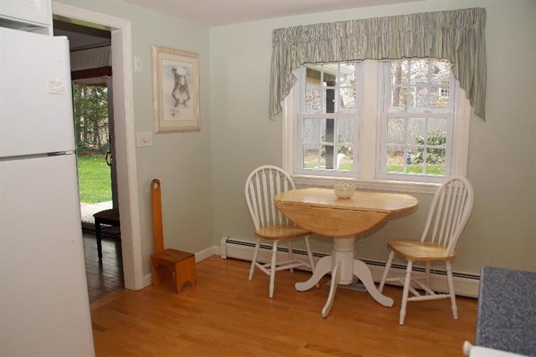 29 Jesse Eldredge Road Harwich, MA 02645 - Photo 15 of 25 a view of a dining room with furniture and a window