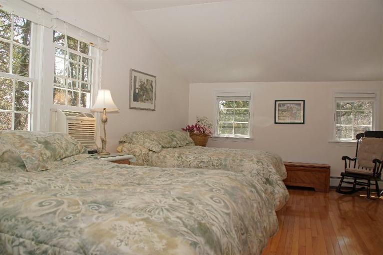 29 Jesse Eldredge Road Harwich, MA 02645 - Photo 16 of 25 a bed room with a bed furniture and a window