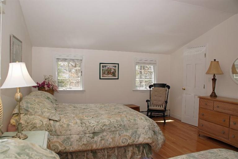 29 Jesse Eldredge Road Harwich, MA 02645 - Photo 17 of 25 a bedroom with a bed and a window