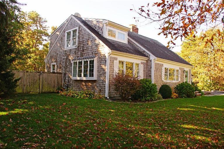 29 Jesse Eldredge Road Harwich, MA 02645 - Photo 2 of 25 a front view of a house with garden