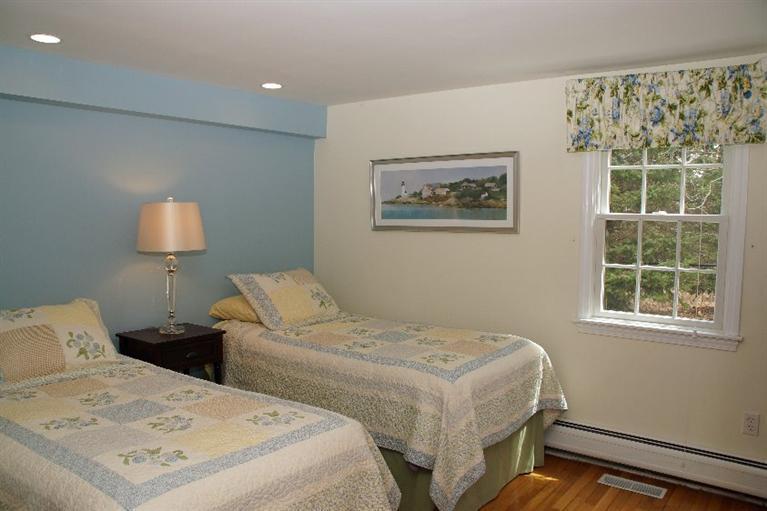 29 Jesse Eldredge Road Harwich, MA 02645 - Photo 21 of 25 a bedroom with two beds and a window