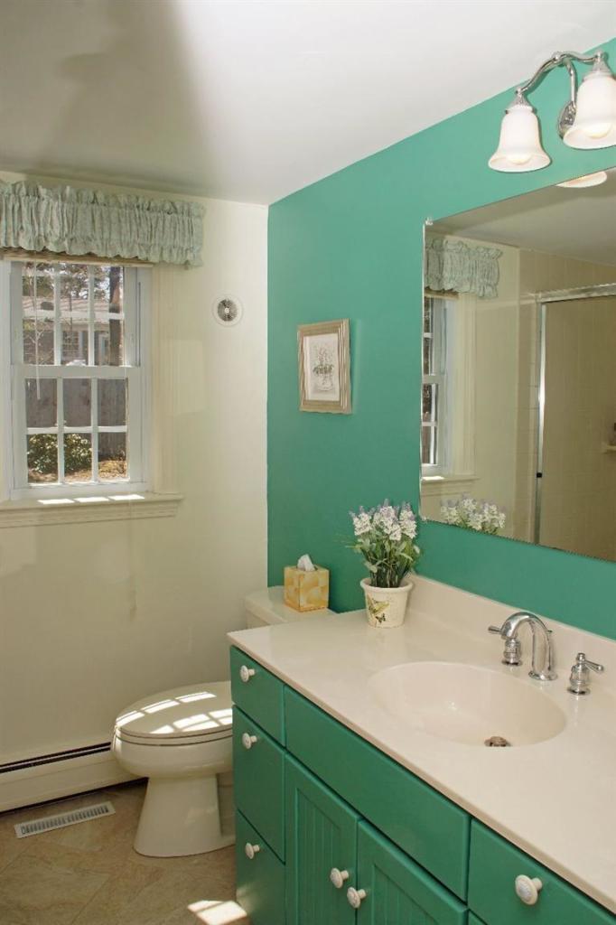 29 Jesse Eldredge Road Harwich, MA 02645 - Photo 22 of 25 a bathroom with a sink and a mirror