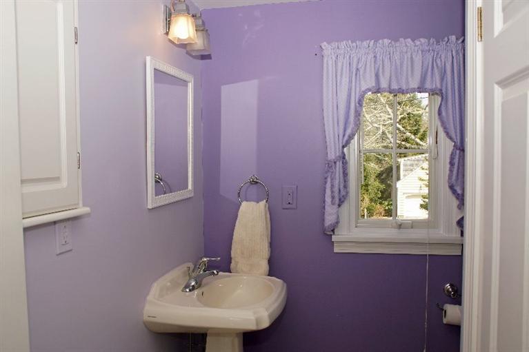 29 Jesse Eldredge Road Harwich, MA 02645 - Photo 23 of 25 a bathroom with a sink and a mirror