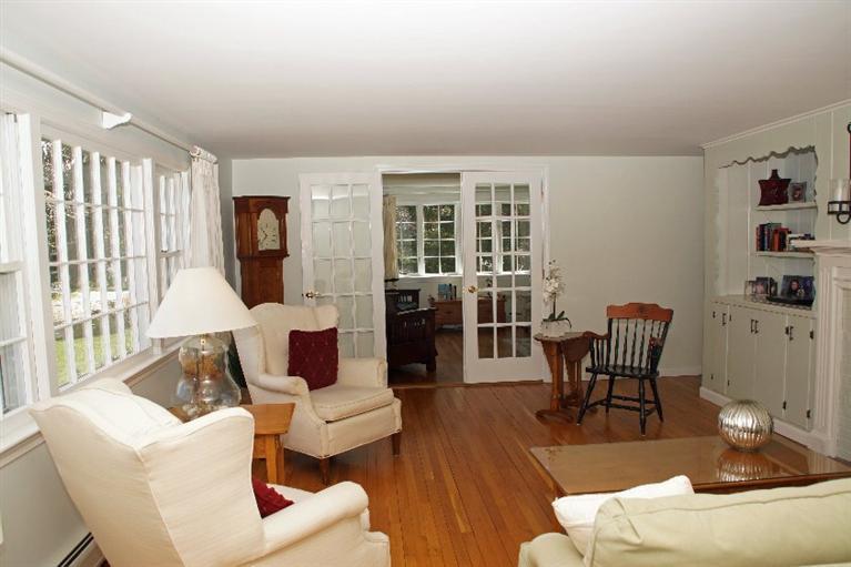 29 Jesse Eldredge Road Harwich, MA 02645 - Photo 6 of 25 a living room with furniture or couch and a wooden floor