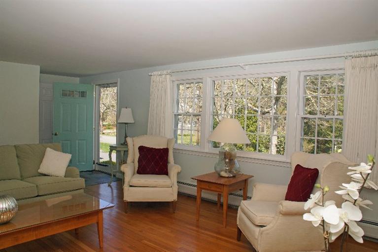 29 Jesse Eldredge Road Harwich, MA 02645 - Photo 8 of 25 a living room with furniture and a large window