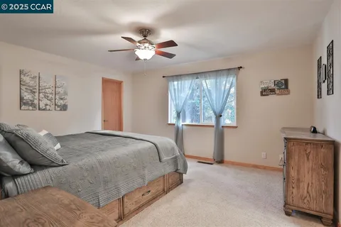 a bedroom with a bed and window