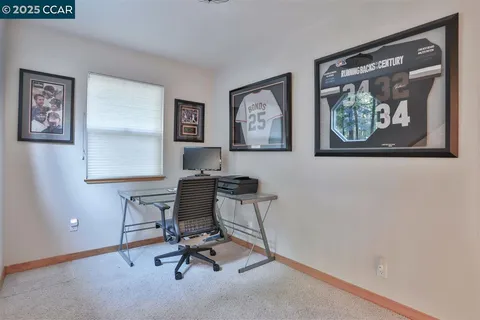 a view of a workspace with painting on the wall