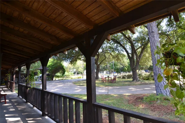a view of porch with a garden