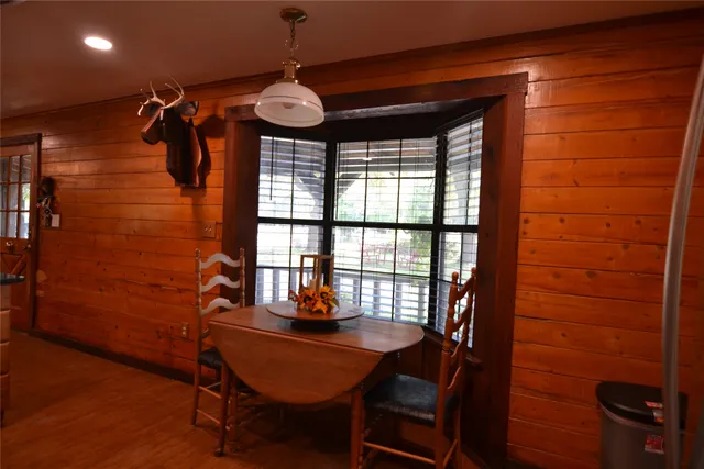 a view of a dining room with furniture and window