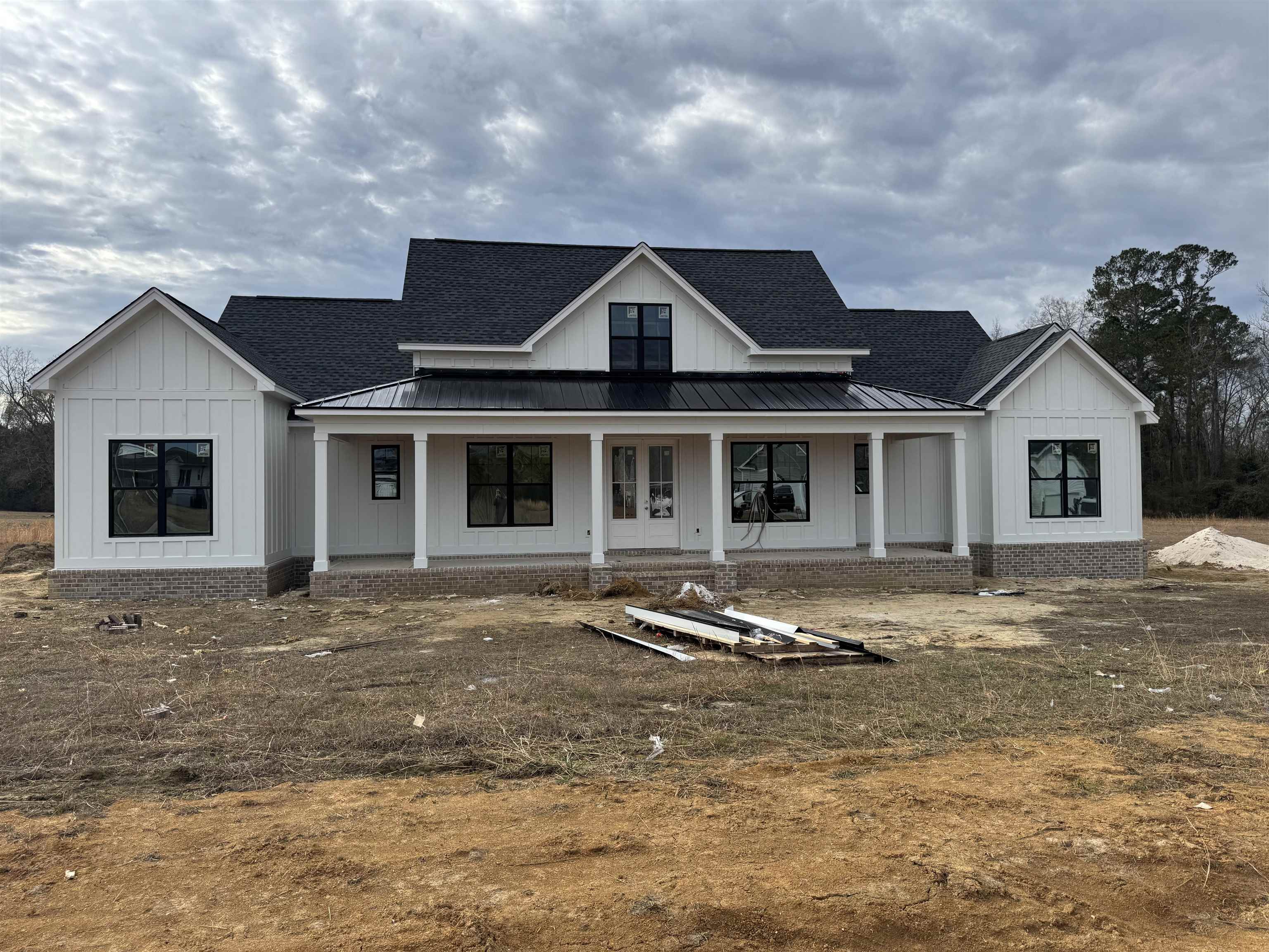 6861 Highway 804 Conway, SC 29527 - Photo 1 of 20 View of front of property featuring covered porch, board and batten siding, a standing seam roof, a shingled roof, and a metal roof