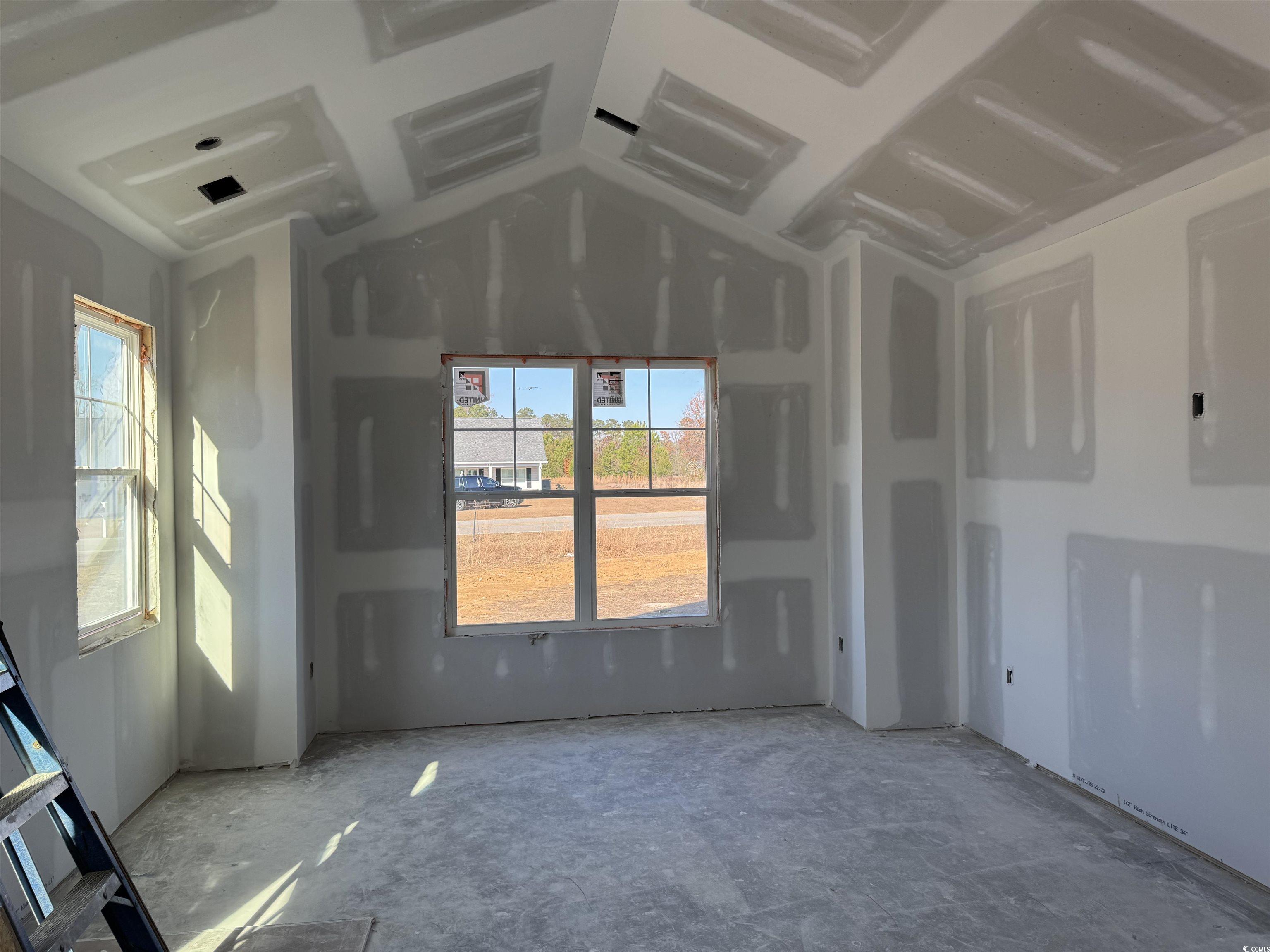 6861 Highway 804 Conway, SC 29527 - Photo 8 of 18 Empty room with vaulted ceiling and electric panel