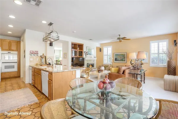 a large kitchen with a table and chairs