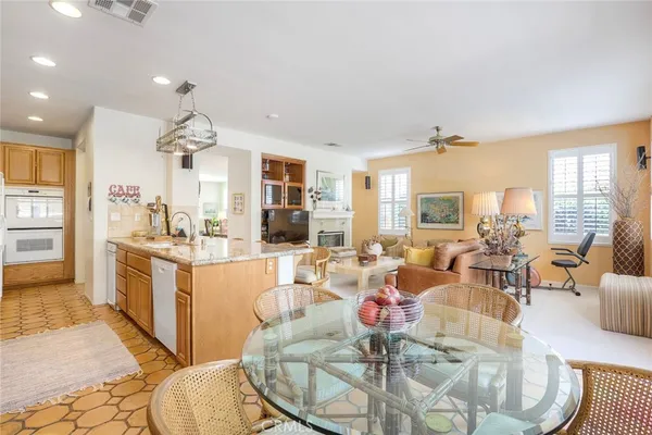 a large kitchen with a table and chairs