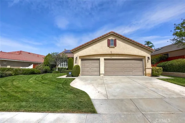 a front view of a house with yard