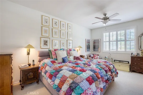 a bedroom with bed and a window