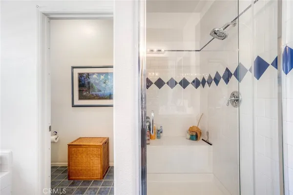a bathroom with a shower and a sink