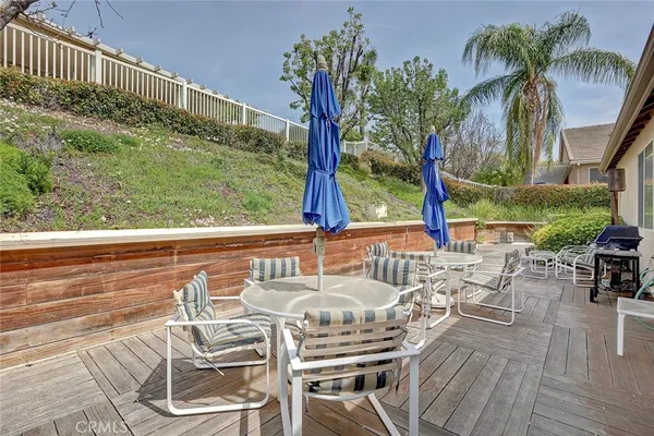 a view of swimming pool with outdoor seating and city view