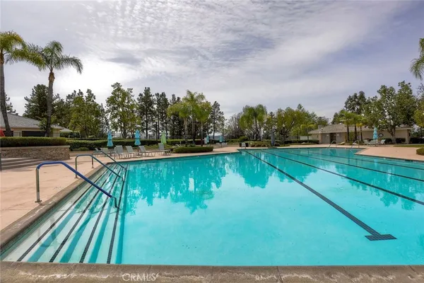 a view of swimming pool with a yard