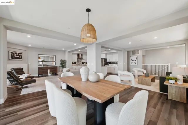 a dining room with furniture and wooden floor