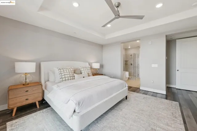 a bathroom with a toilet tub and glass door