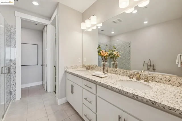 a bedroom with bed and a window