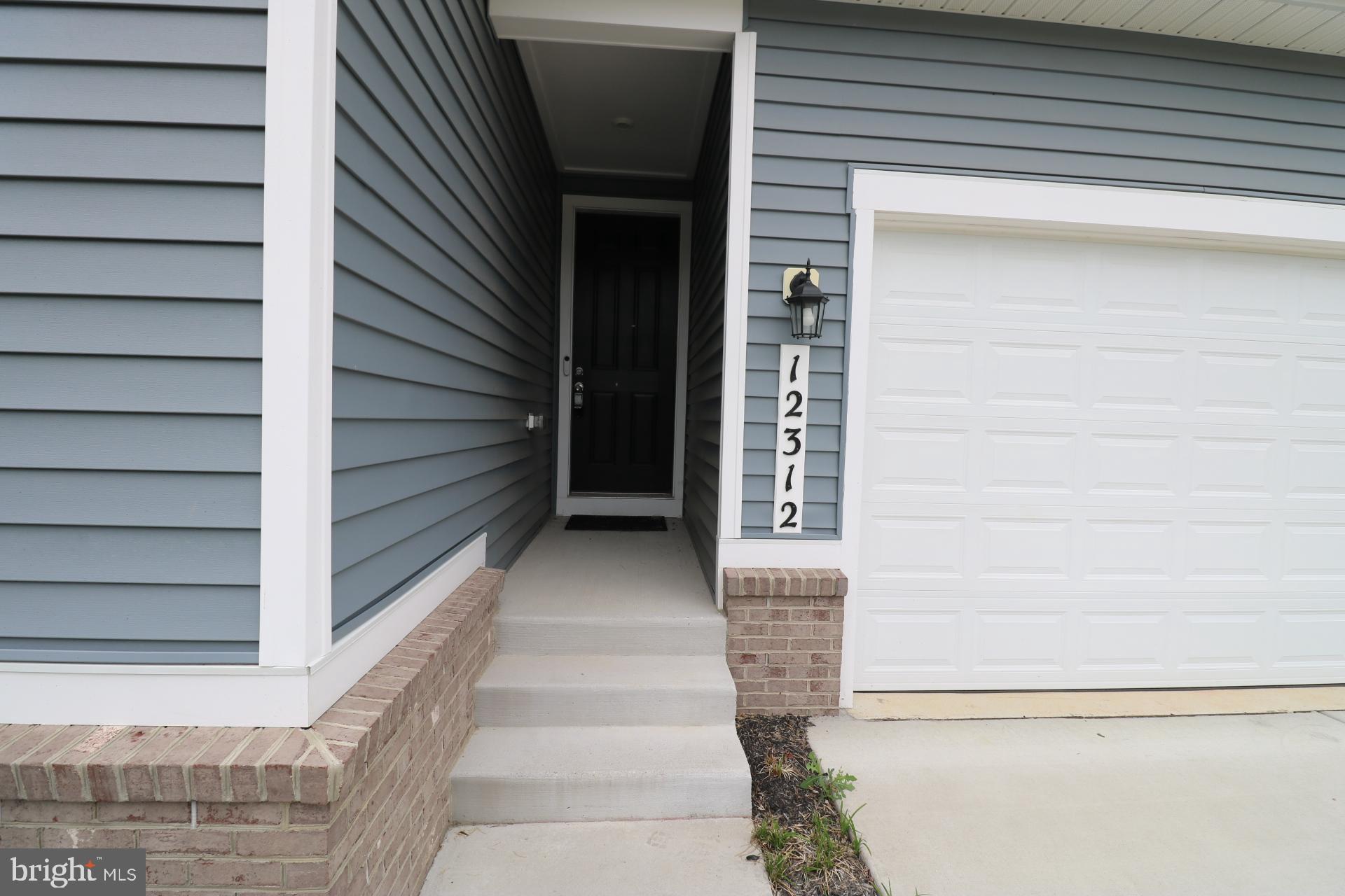 12312 Fallen Timbers Circle Hagerstown, MD 21740 - Photo 12 of 28 a view of staircase with white walls and windows