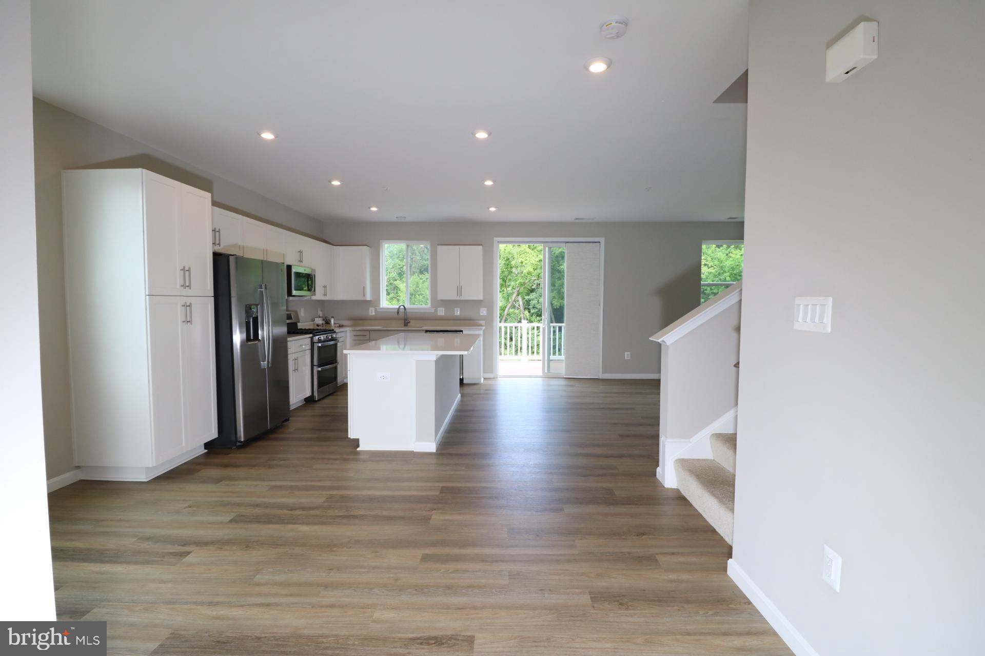 12312 Fallen Timbers Circle Hagerstown, MD 21740 - Photo 14 of 28 a view of a kitchen with wooden floor and a refrigerator