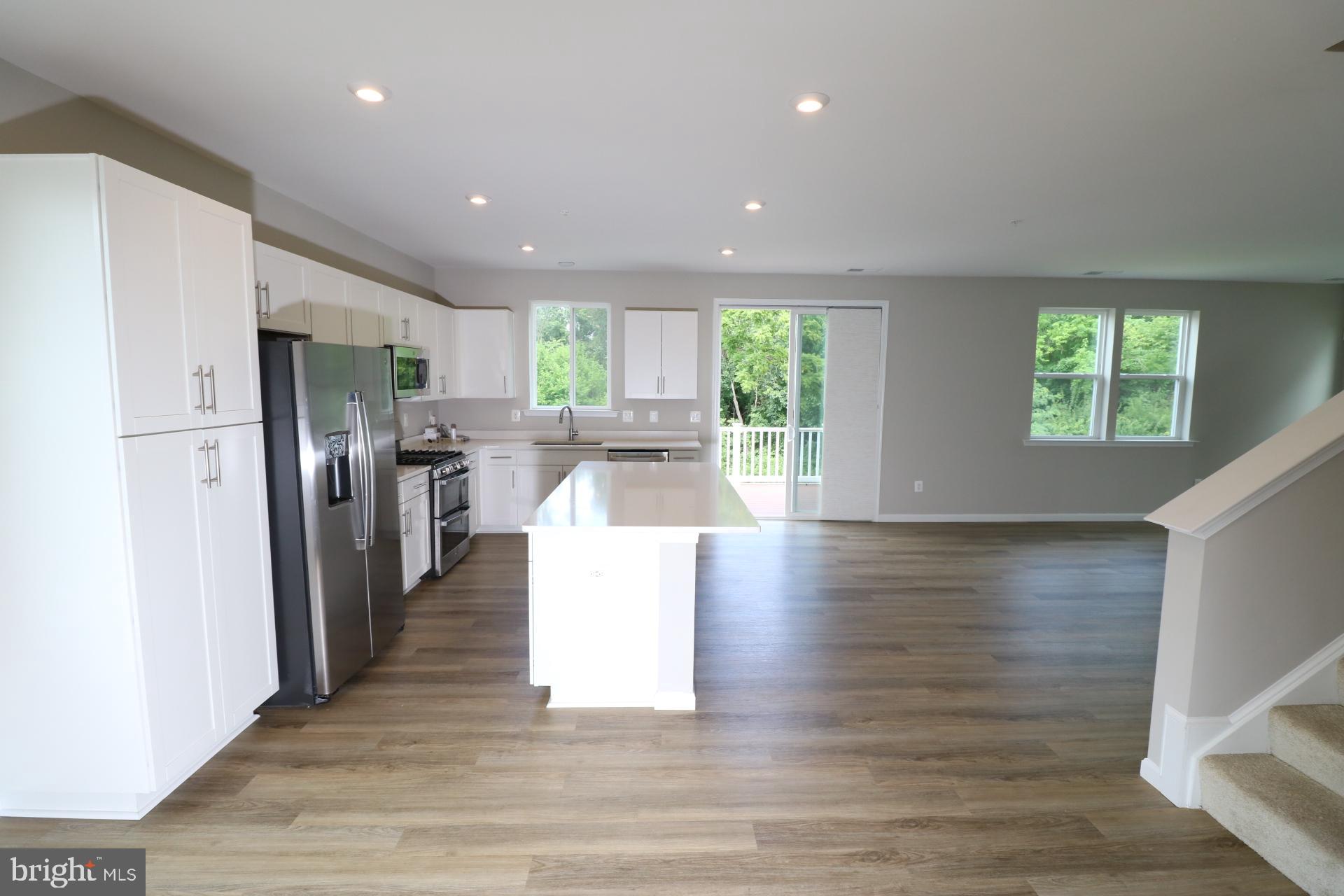 12312 Fallen Timbers Circle Hagerstown, MD 21740 - Photo 15 of 28 a view of a kitchen center island wooden floor and stainless steel appliances