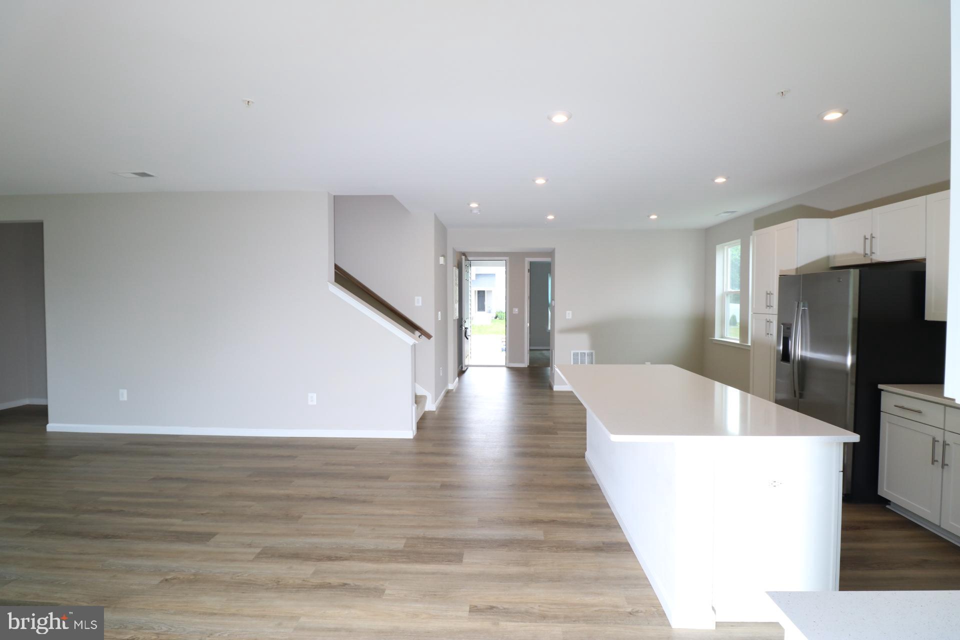 12312 Fallen Timbers Circle Hagerstown, MD 21740 - Photo 22 of 28 a view of a livingroom with furniture wooden floor and staircase