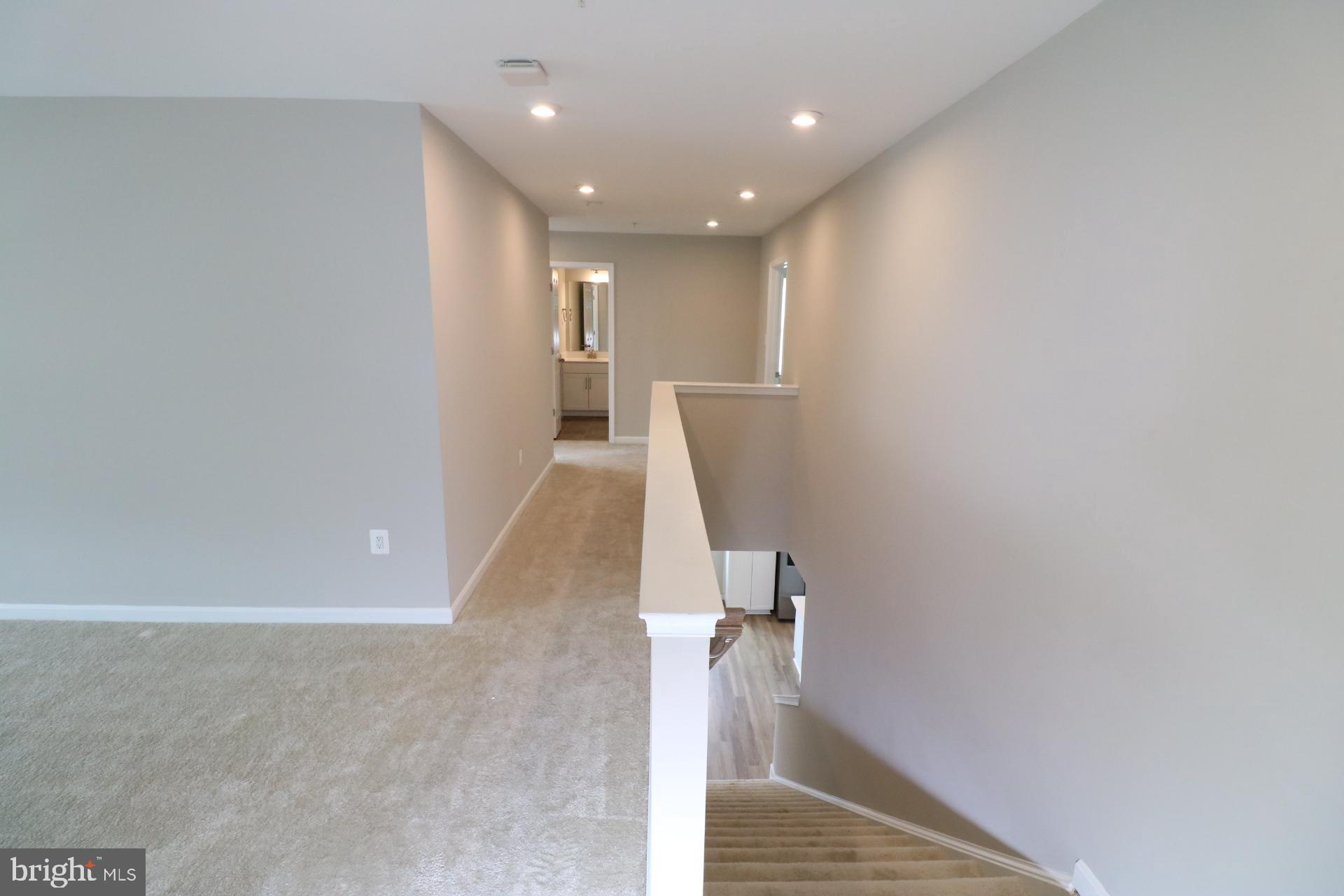 12312 Fallen Timbers Circle Hagerstown, MD 21740 - Photo 26 of 28 a view of a hallway with stairs