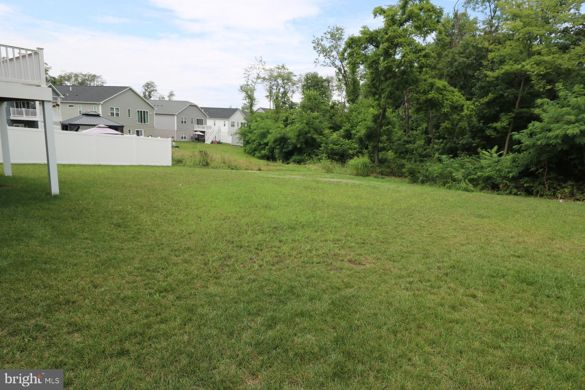 12312 Fallen Timbers Circle Hagerstown, MD 21740 - Photo 7 of 28 a view of a field with a house in the background